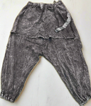 Flat lay back view of black acid wash drop-crotch pants