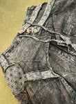 Flat lay front view of black acid wash drop-crotch pants upper details