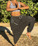 Front leg up view of black acid wash cotton drop-crotch pants
