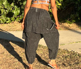 back view of black acid wash drop-crotch pants with elastic cuffs