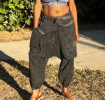 Standing front view of black acid wash cotton drop-crotch pants