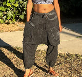 Standing front view of black acid wash cotton drop-crotch pants