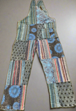 Flat lay back view of blue patchwork cotton overalls