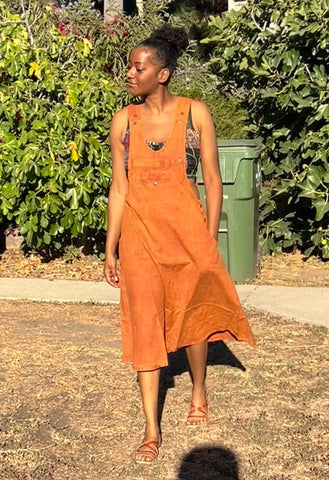 Front view of handmade burnt orange cotton overall dress