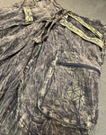 Close-up of zippered side pocket on olive green drape back pants