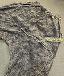 Flat lay back view of olive green pants showing drape panel