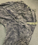Flat lay back view of olive green pants showing drape panel