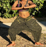 Front view of olive green drape back cotton pants with relaxed fit in a wide stance
