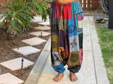 Model wearing patchwork harem pants standing in relaxed front stance