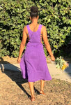 Back view of purple overall style cotton dress