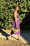 Side view of purple cotton overall dress showing relaxed fit