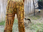 Closeup back view of sunflower patchwork pants showing back pocket