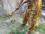 Close-up of drawstring waist and patchwork details on sunflower pants