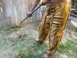 Close-up of drawstring waist and patchwork details on sunflower pants