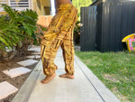 Side view of sunflower patchwork pants with golden tones