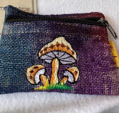 Front view of handmade tie-dye pouch in blue to purple with embroidery