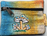Front view of handmade tie-dye pouch in yellow to blue with embroidery