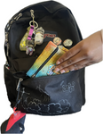 Yellow to blue tie-dye pouch placed in the front pocket of a backpack