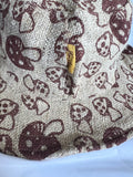 hemp mushroom bucket hat side view detail of tag and brim on a white background