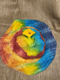 Rainbow tie dye hat top view on a jute fabric background
