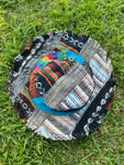 Top view of dark toned patchwork bucket hat with frayed brim
