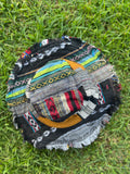 Top view of dark multicolor patchwork bucket hat with frayed brim