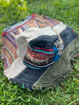 Angled view of light multicolor patchwork bucket hat with frayed brim