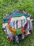 Top view of multicolor patchwork bucket hat with frayed brim